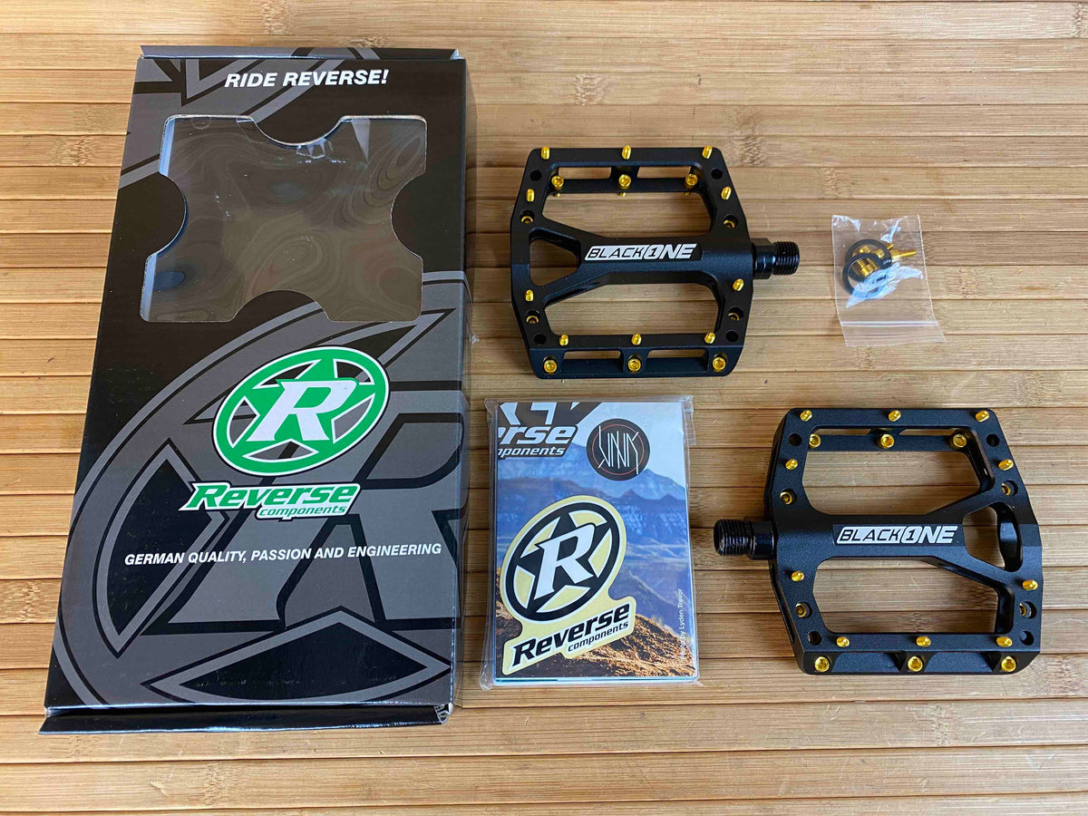 Reverse Components Black One Plattformpedale / Pedale schwarz/gold