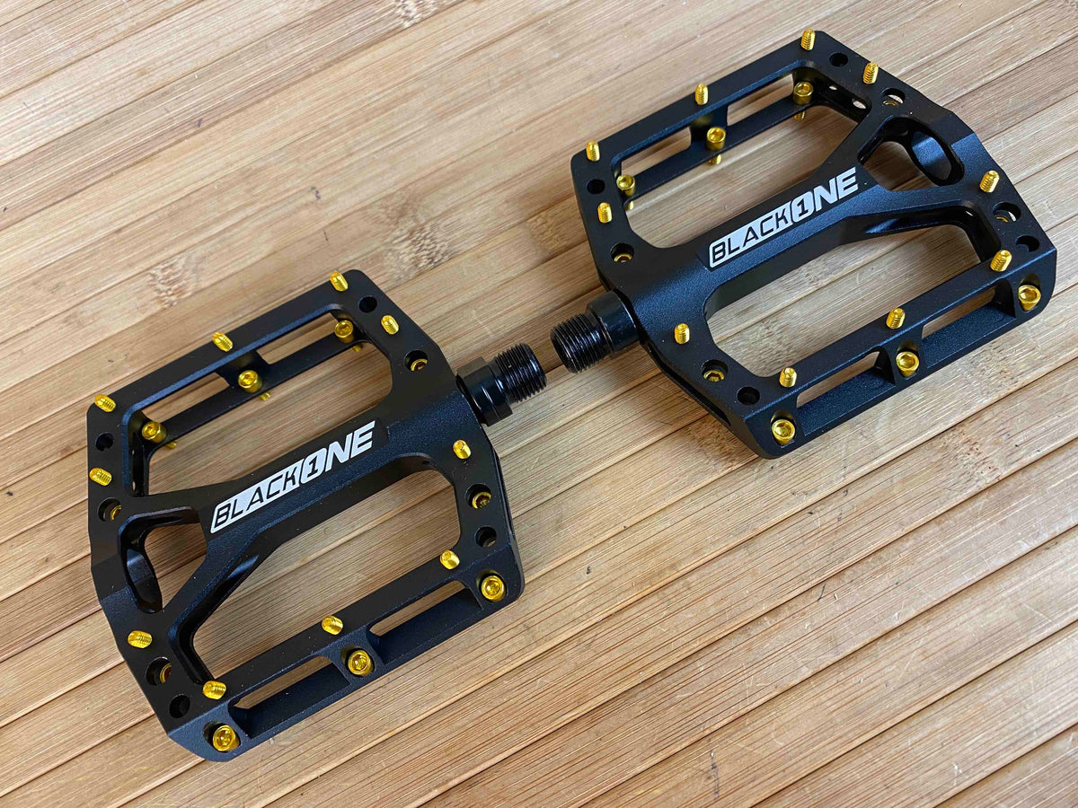 Reverse Components Black One Plattformpedale / Pedale schwarz/gold – RTF  Bikeparts